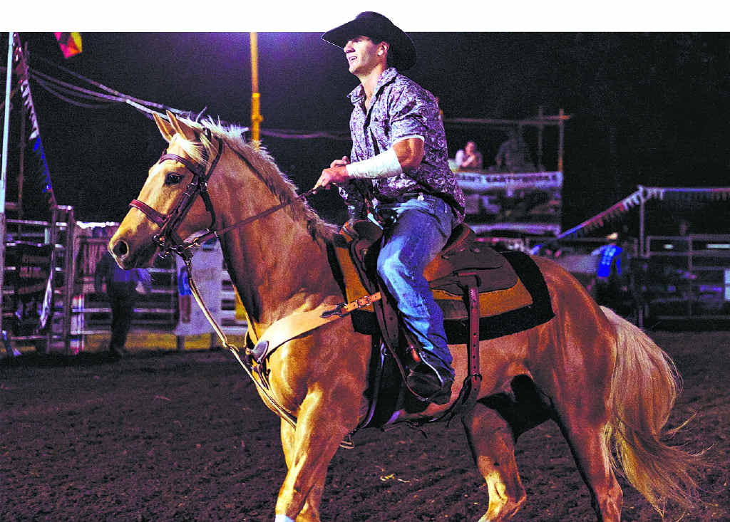 HOME GROWN: Local cowboy Owen Lee performs a victory lap after placing first in round one of the open bareback ride at the Proserpine Lions Rodeo for Suicide Prevention on Friday night. HOME GROWN: Local cowboy Owen Lee performs a victory lap after placing first in round one of the open bareback ride at the Proserpine Lions Rodeo for Suicide Prevention on Friday night.